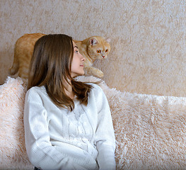 Image showing Girl and red cat
