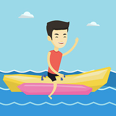 Image showing Tourists riding a banana boat vector illustration.