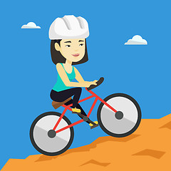 Image showing Young woman on bicycle traveling in the mountains.