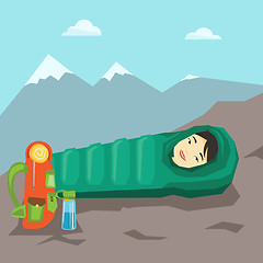 Image showing Woman sleeping in sleeping bag in the mountains.