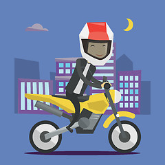 Image showing Young man riding motorcycle at night.