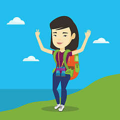 Image showing Backpacker with her hands up enjoying the scenery.