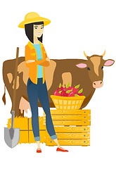 Image showing Farmer standing with crossed arms near cow.