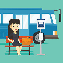 Image showing Business woman waiting at the bus stop.