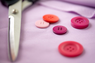Image showing scissors, sewing buttons and cloth