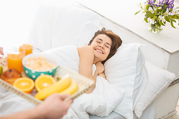 Image showing Relaxed Couple in Bed in bedroom at home