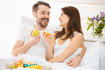 Image showing Relaxed Couple in Bed in bedroom at home