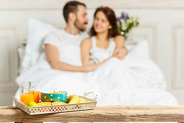 Image showing Relaxed Couple in Bed in bedroom at home