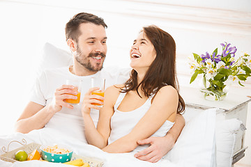 Image showing Relaxed Couple in Bed in bedroom at home