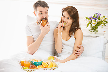 Image showing Relaxed Couple in Bed in bedroom at home