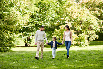 Image showing happy family walking in summer park