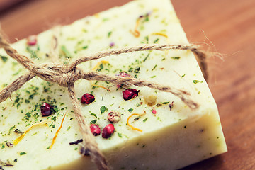 Image showing close up of handmade soap bars on wood