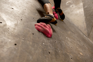 Image showing foot of woman exercising at indoor climbing gym