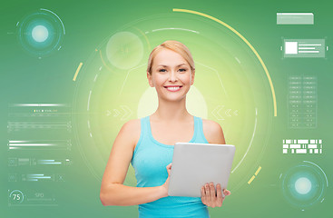 Image showing happy smiling sporty woman with tablet pc