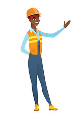 Image showing African-american builder showing a direction.