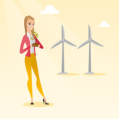 Image showing Woman holding small plant vector illustration.