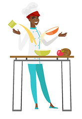 Image showing Young african-american chef cook preparing food.