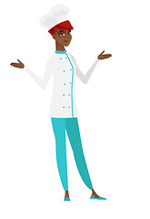 Image showing African confused chef cook with spread arms.