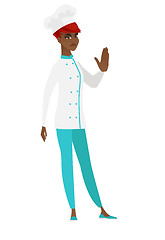 Image showing African chef cook showing stop hand gesture.