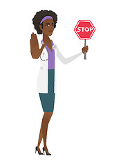 Image showing African-american doctor holding stop road sign.