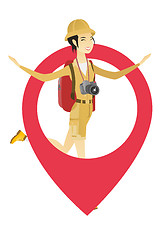 Image showing Traveler woman jumping through a big map pointer.