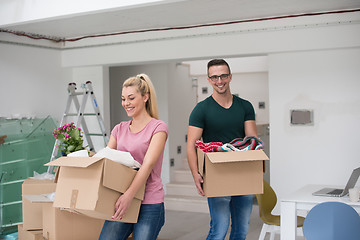 Image showing young couple moving into a new home