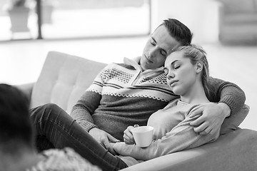 Image showing Young couple  in front of fireplace