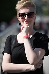 Image showing young woman with short blond hair and sunglasses