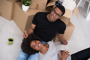 Image showing African American couple relaxing in new house