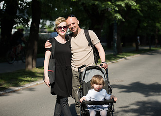 Image showing couple with baby pram in summer park