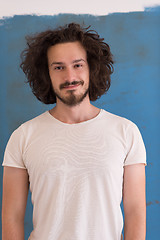 Image showing young man with funny hair over color background