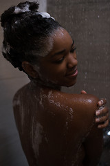 Image showing African American woman in the shower