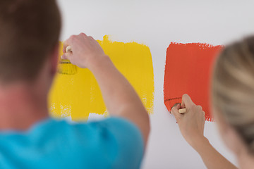 Image showing couple painting interior wall