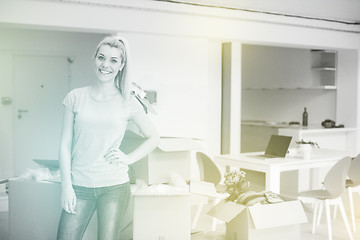 Image showing girl moving in the new apartment