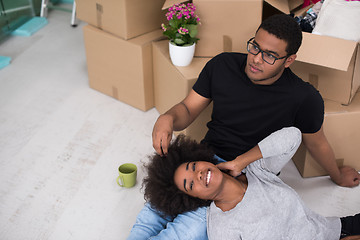 Image showing African American couple relaxing in new house