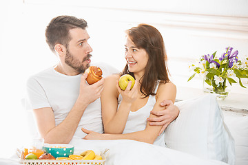 Image showing Relaxed Couple in Bed in bedroom at home