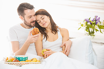 Image showing Relaxed Couple in Bed in bedroom at home