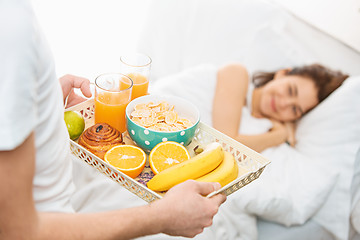 Image showing Relaxed Couple in Bed in bedroom at home