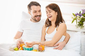 Image showing Relaxed Couple in Bed in bedroom at home