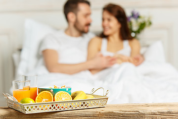 Image showing Relaxed Couple in Bed in bedroom at home