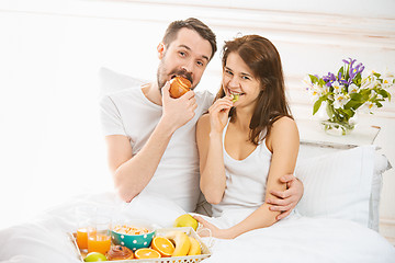 Image showing Relaxed Couple in Bed in bedroom at home