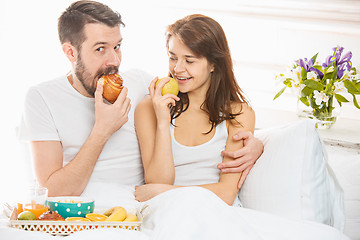 Image showing Relaxed Couple in Bed in bedroom at home