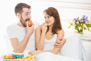 Image showing Relaxed Couple in Bed in bedroom at home