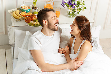 Image showing Relaxed Couple in Bed in bedroom at home