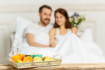 Image showing Relaxed Couple in Bed in bedroom at home