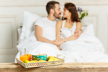 Image showing Relaxed Couple in Bed in bedroom at home