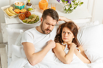 Image showing Relaxed Couple in Bed in bedroom at home