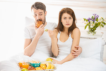 Image showing Relaxed Couple in Bed in bedroom at home