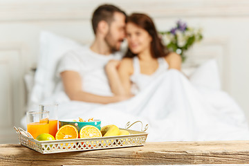 Image showing Relaxed Couple in Bed in bedroom at home