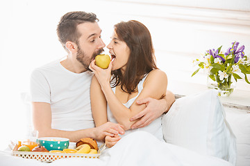 Image showing Relaxed Couple in Bed in bedroom at home